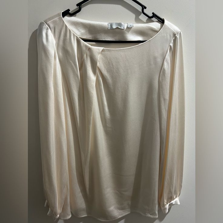 Chic Ivory Colored Satin Blouse With Long Sleeve And Silver Buttons. Brand New. Elegant Cream Long Sleeve Tops, Elegant Cream Office Tops, Elegant Long Sleeve Cream Tops, Spring Cream Blouse For Formal Occasions, Cream Long Sleeve Blouse For Evening, Spring Formal Cream Blouse, Cream Blouse For Spring Formal Occasions, Chic Cream Formal Top, Classic Cream Top For Party