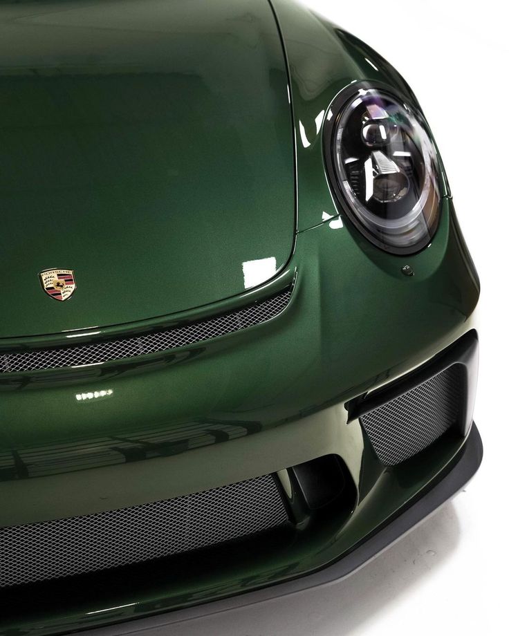 the front end of a green sports car