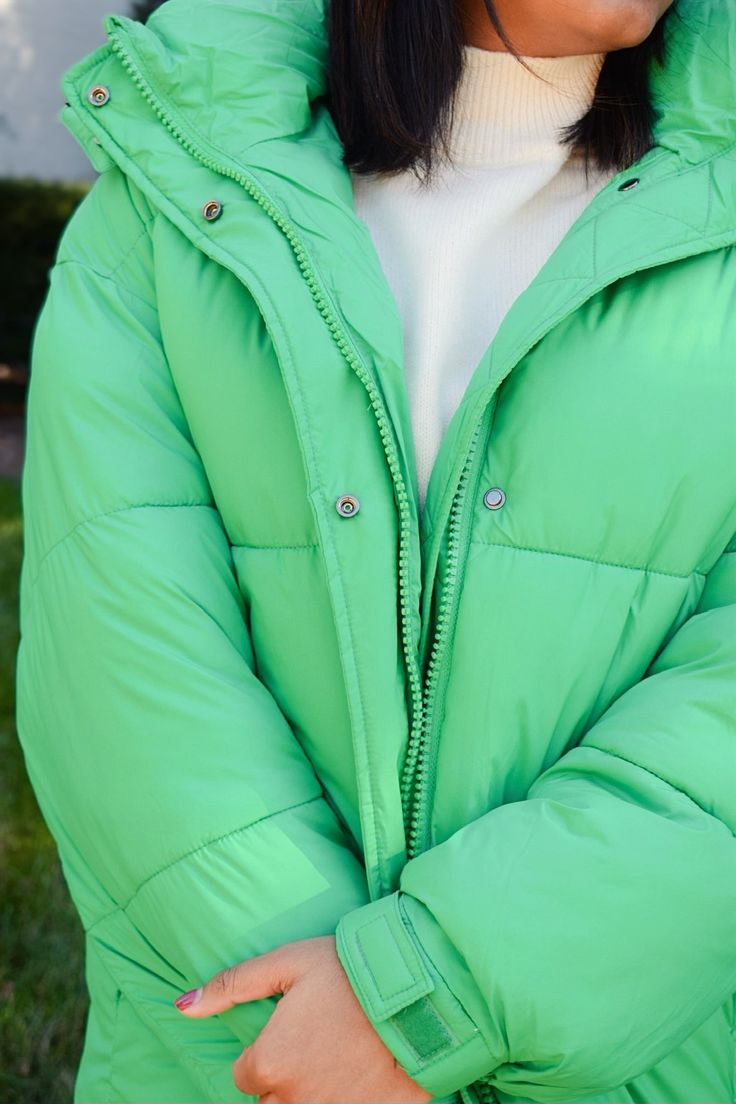 Long Sleeved Puffer Featuring Removable Hood Color: Green 100% Nylon Fits Oversized Urban Nylon Puffer Jacket For Spring, Spring Outdoor Down Outerwear, Trendy Outdoor Hooded Jacket With Detachable Hood, Trendy Outerwear With Detachable Hood For Outdoor, Trendy Outerwear With Detachable Hood For Outdoor Activities, Trendy Outdoor Outerwear With Detachable Hood, Spring Functional Puffer Jacket For Streetwear, Trendy Solid Parka With Detachable Hood, Spring Puffer Jacket With Padded Collar For Outdoor