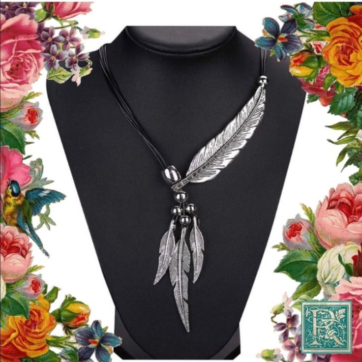 This Silver Tone Necklace Features 1 Large Feather Across The Neck With Rhinestones Along The Spine, And 3 Hanging Pendant Feathers. Necklace Measure 20 Inches And Has A Three Inch Extender In Back, Silver Feather Necklace, 20 Inch Necklace, Large Feathers, Feather Necklace, Feather Necklaces, Hanging Pendant, Hanging Pendants, Womens Jewelry Necklace, Size 20