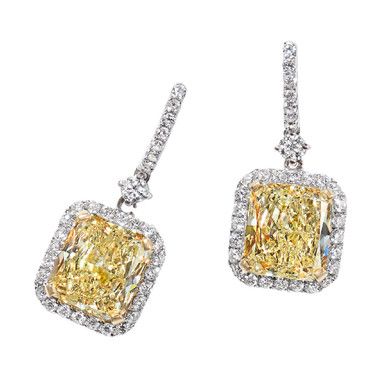 A stunning pair of dangle earrings featuring 6.03 carats of fancy yellow diamonds, accented by 0.81 carats of diamonds, set in 18 karat two tone gold. Yellow Diamond Earrings With Diamond Accents, Luxury Yellow Diamond Drop Earrings, Formal Yellow Diamond Earrings, Yellow Diamond Earrings For Formal Occasions, Wedding Yellow Diamond Earrings With Accents, Fine Jewelry Yellow Diamond Earrings, Yellow Diamond Earrings With Accents For Wedding, Yellow Diamond Earrings With Diamond Accents For Wedding, Yellow Diamond Earrings In Fine Jewelry Style