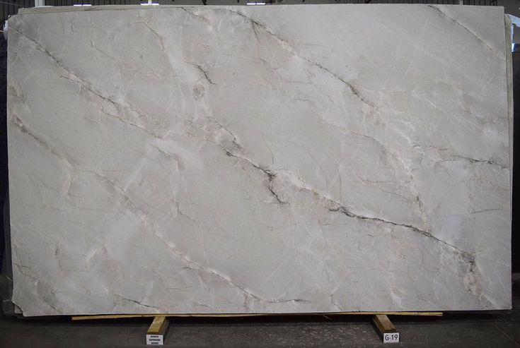 a large white marble slab in a warehouse