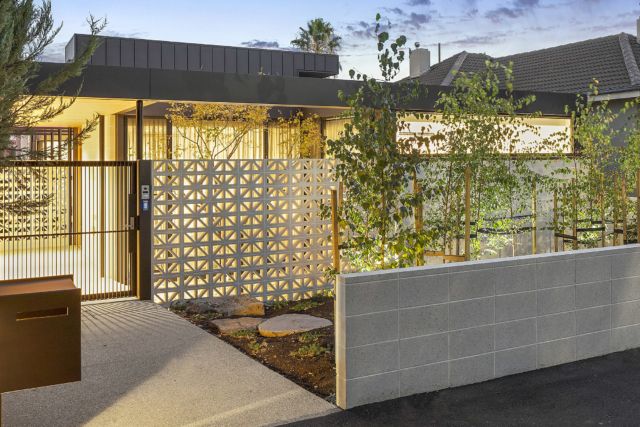 a house with a fence in front of it