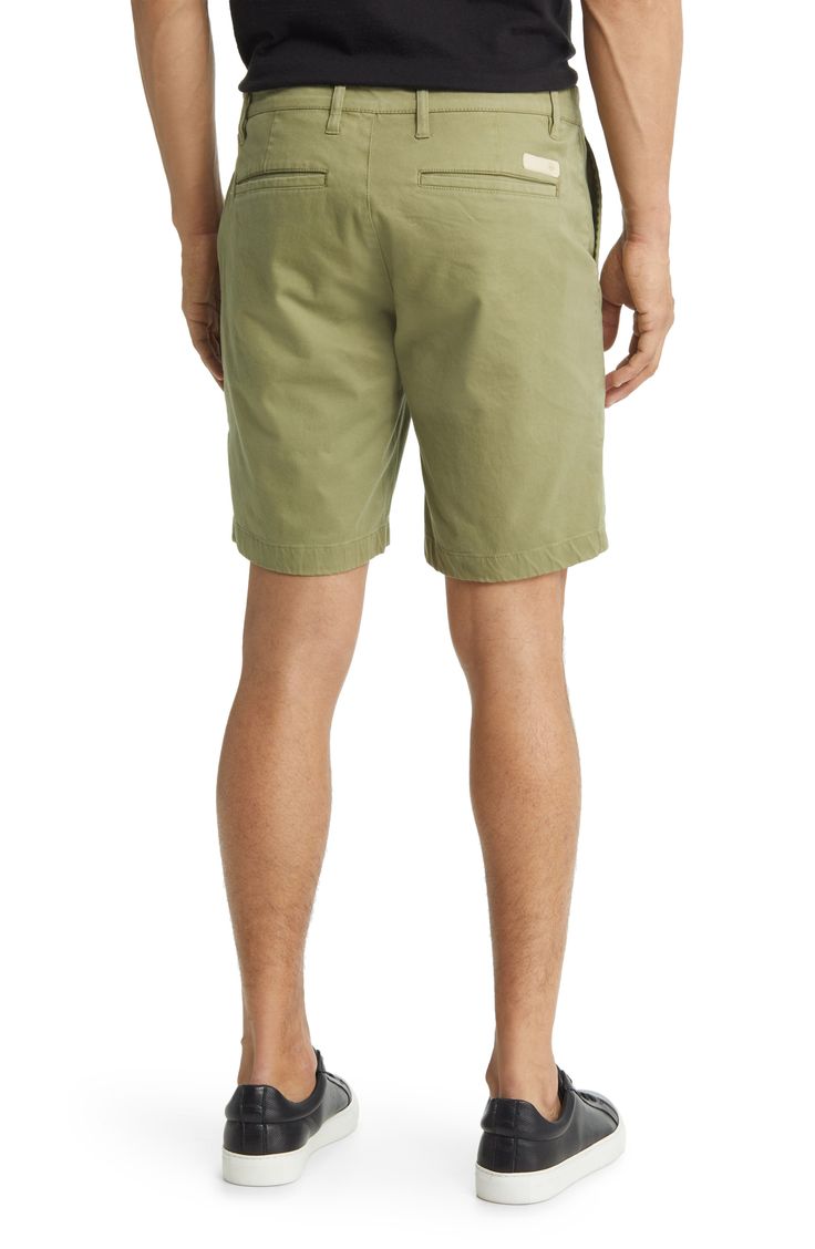 These breezy shorts keep you feeling at ease in the all-day comfort of stretch-softened cotton. 8 1/2" inseam; 20" leg opening; 10 1/2" front rise; 15" back rise (size 32) Zip fly with button closure Front slant pockets; back welt pockets 98% cotton, 2% elastane Machine wash, tumble dry Imported Relaxed Fit Bermuda Shorts With 5-inch Inseam, Cotton Bermuda Shorts With Built-in Shorts, Cotton Bermuda Shorts With 5-inch Inseam For Summer, Stretch Cotton Shorts With 5-inch Inseam, Solid Bermuda Shorts With Relaxed Fit, Cotton Bermuda Shorts With Short Inseam, Stretch Cotton Bermuda Shorts With Elastic Waistband, Relaxed Fit Knee-length Bermuda Shorts With Elastic Waistband, Knee-length Cotton Bottoms With Elastic Waistband