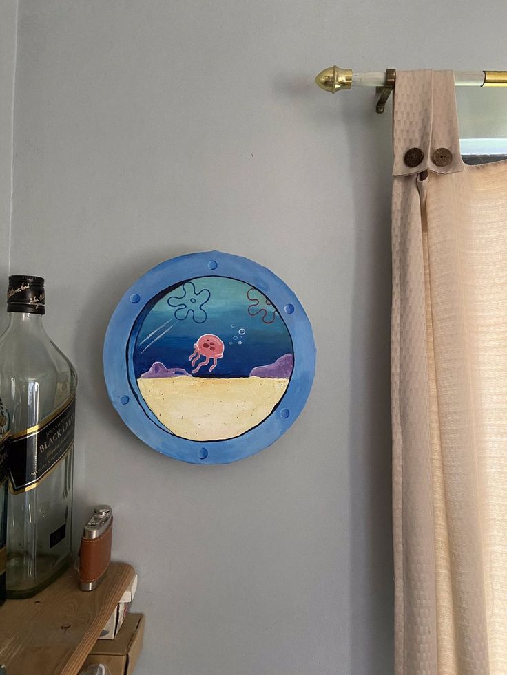 a bathroom with a sink, mirror and shower curtain hanging on the wall above it