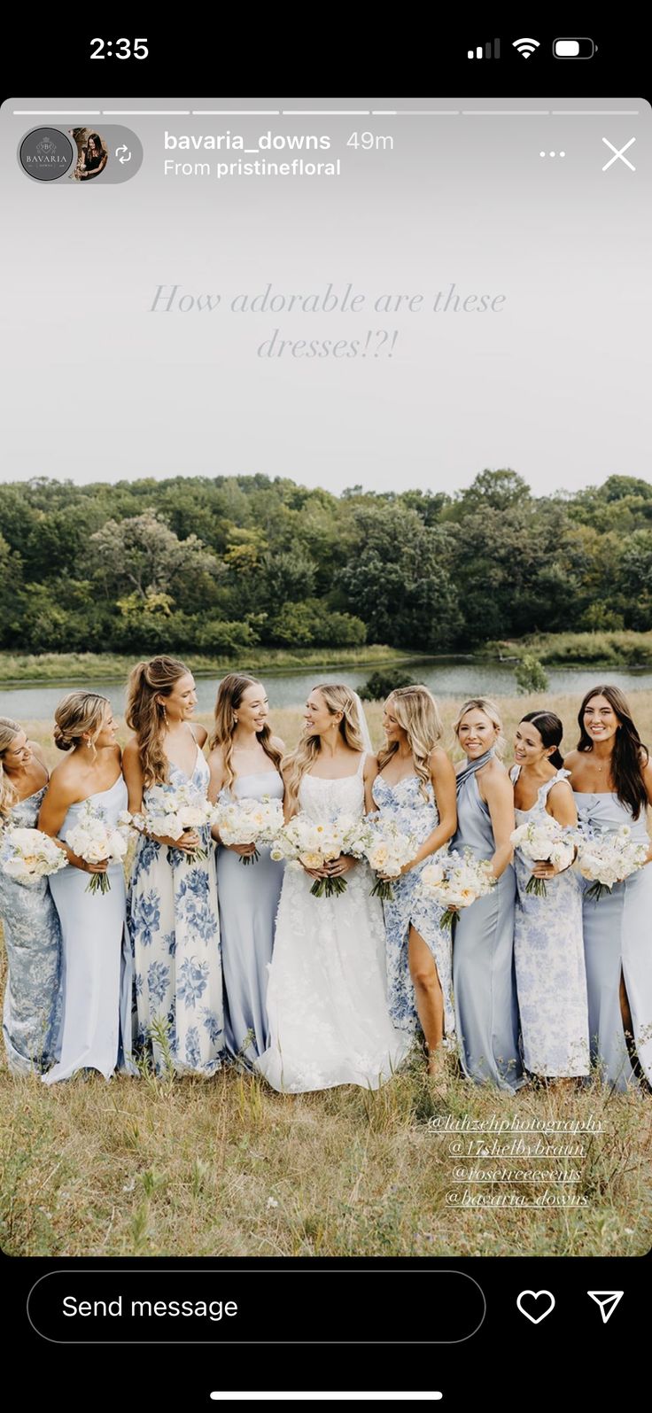 a group of women standing next to each other in front of a field with trees