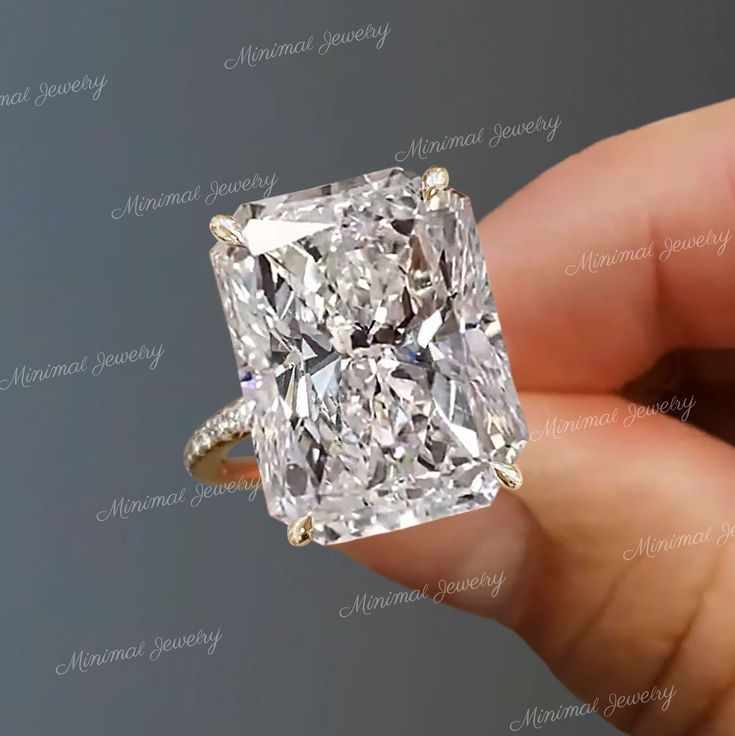 a person holding a diamond ring in their hand