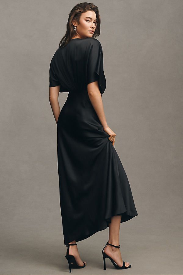 Timelessly elegant, the BHLDN Amelia Gown pairs a gracefully draped bodice with soft sleeves and a flowy skirt. A daring plunge neckline completes the look. | Amelia Deep-V Satin Maxi Dress by BHLDN in Black, Women's, Size: Largearge, Polyester/Viscose/Satin at Anthropologie Draped Bodice, Plunge Neckline, Satin Maxi, Satin Maxi Dress, Flowy Skirt, Plunging Neckline, Black Maxi Dress, Deep V, Bodice