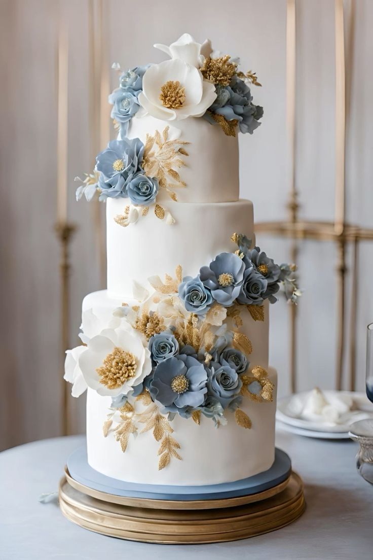 a wedding cake with blue and white flowers on it