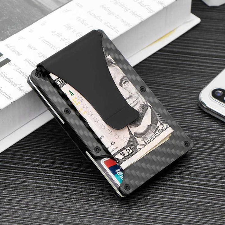 You can carry up to 16 cards & 20 bills using the attached money clip or cash strap at a fraction of the size of a traditional wallet. And with the quick access feature, just a push of your fingertip to quickly select the card of your choice. It’s a reimagination of what the modern wallet can be. RIFD blocking credit card wallet can prevent your card information from being read by thief scanned devices and ensure your private property information safety. Made of premium aviation aluminum / carbo Carbon Fiber Wallet, Tactical Wallet, Modern Wallet, Ridge Wallet, Aluminum Wallet, Rfid Blocking Wallet, Front Pocket Wallet, Rfid Wallet, Wallet Gifts