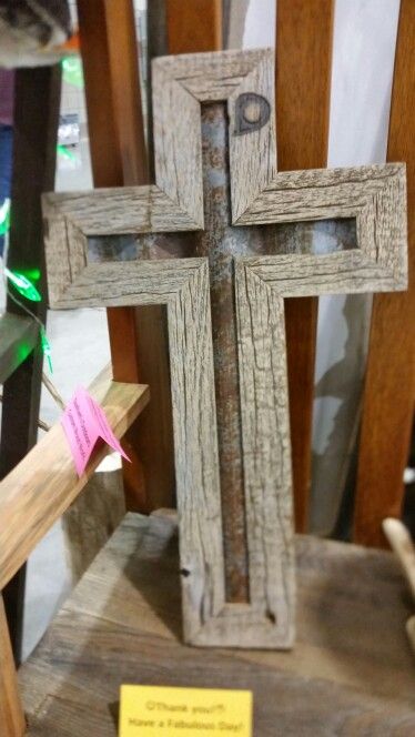 a wooden cross sitting on top of a table