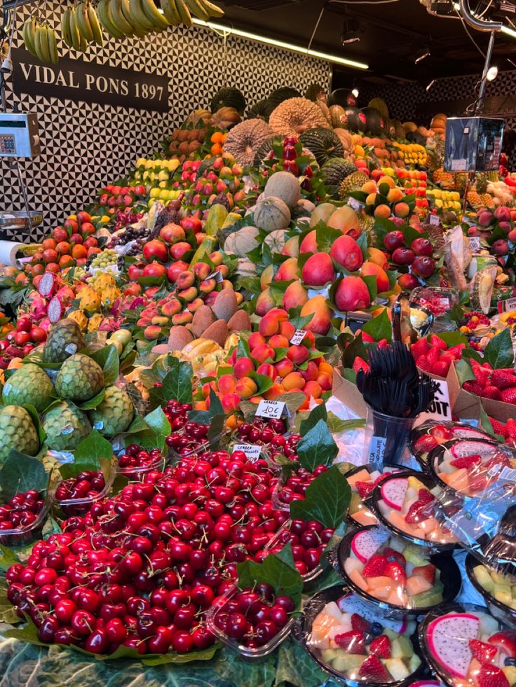 many different types of fruits and vegetables on display