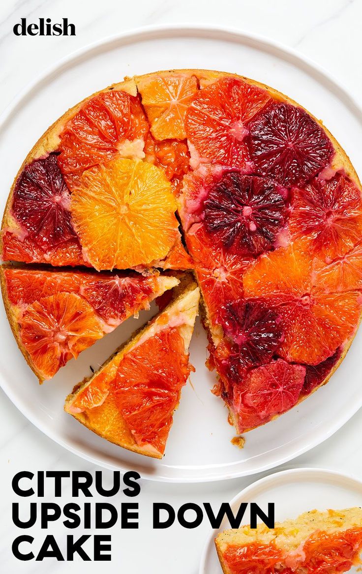 a citrus upside down cake on a white plate with slices cut out and ready to be eaten