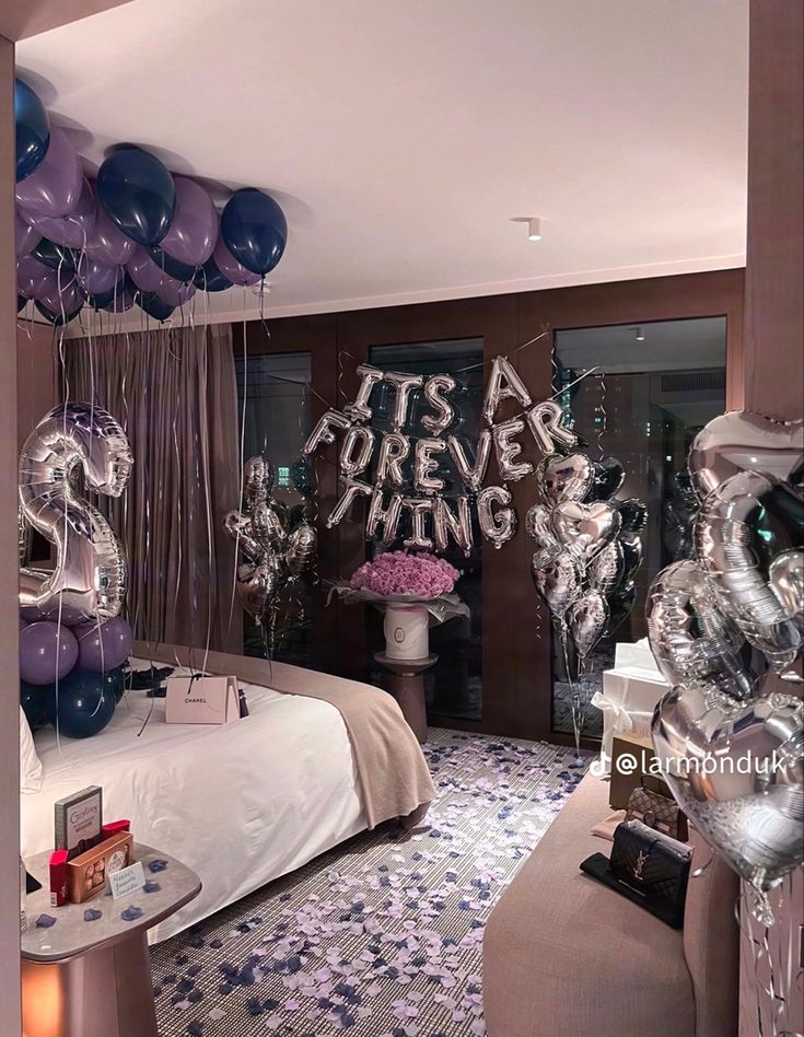 balloons and streamers fill the air in this bedroom decorated for a new year's eve party