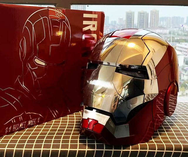 the iron man helmet is next to a red box with an iron man drawing on it