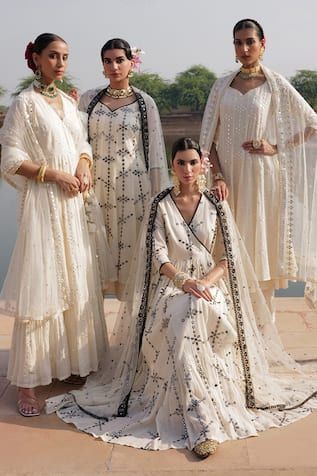 White angarakha with thread embroidered floral patterns, embellished by mirrorwork. Comes with matching dupatta. - Aza Fashions Festive V-neck Lehenga With Resham Embroidery, Embroidered V-neck Sets For Reception, Designer Wear Sets With Resham Embroidery And V-neck, V-neck Traditional Wear With Resham Embroidery For Navratri, Chanderi V-neck Sets For Wedding, V-neck Traditional Wear With Chikankari Embroidery, Traditional V-neck Chikankari Embroidery Wear, V-neck Chanderi Sets For Wedding, V-neck Traditional Wear For Wedding And Festivals