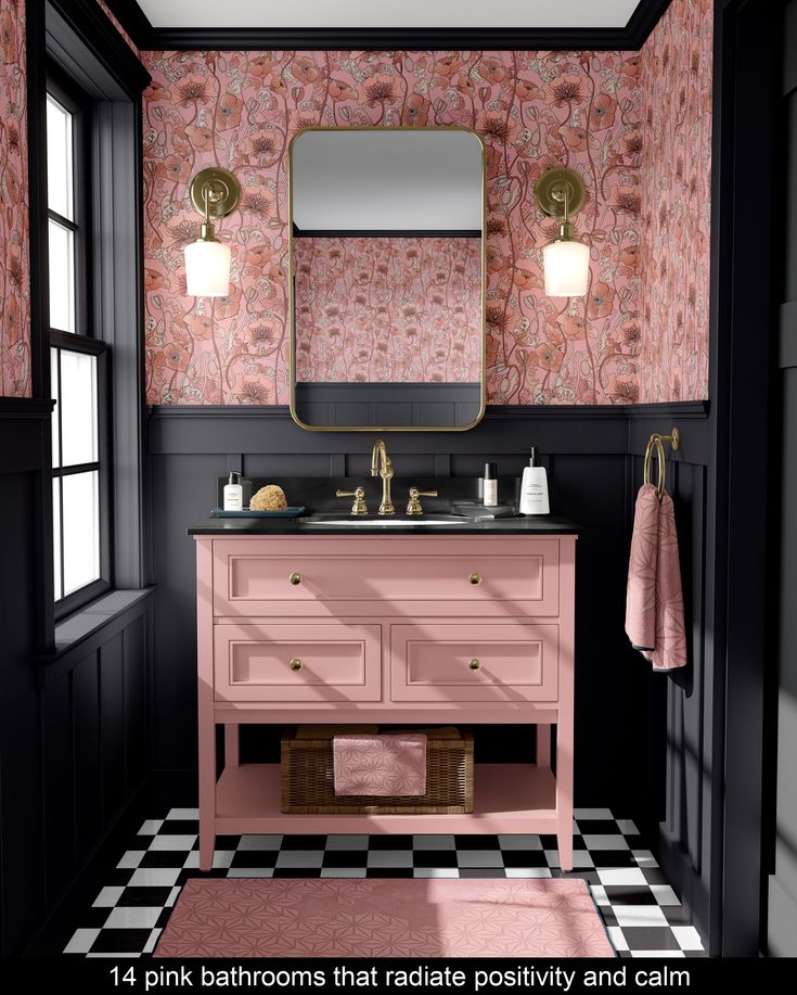 a pink bathroom with black and white checkerboard flooring, gold fixtures and wallpaper