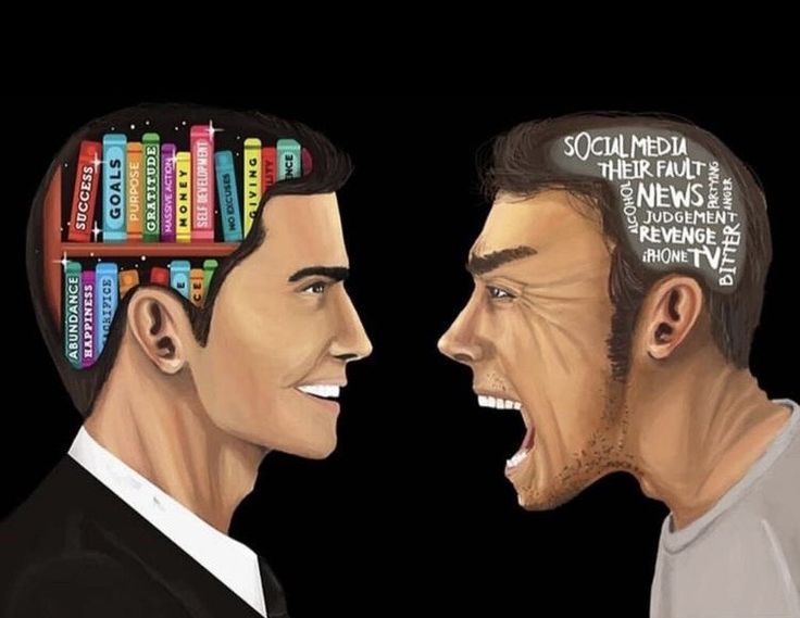 two men with books on their heads are laughing