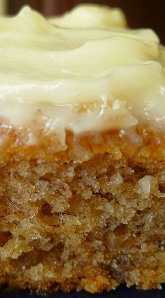 a piece of carrot cake with white frosting