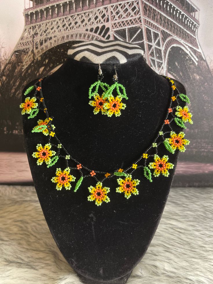 Beautiful set of necklace style flower choker with earrings, handmade by Mexican artisans. Flower Decoration Choker Necklace For Gift, Traditional Flower Necklace As Gift, Handmade Flower Shaped Jewelry For Festivals, Flower Decoration Choker Necklace Gift, Adjustable Green Jewelry With Handmade Flowers, Handmade Flower Necklace For Festivals, Adjustable Handmade Flower Shaped Jewelry, Bohemian Choker Jewelry Set As Gift, Handmade Flower Pendant Jewelry For Festivals