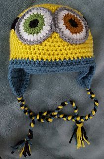 a crocheted hat with eyeballs on it