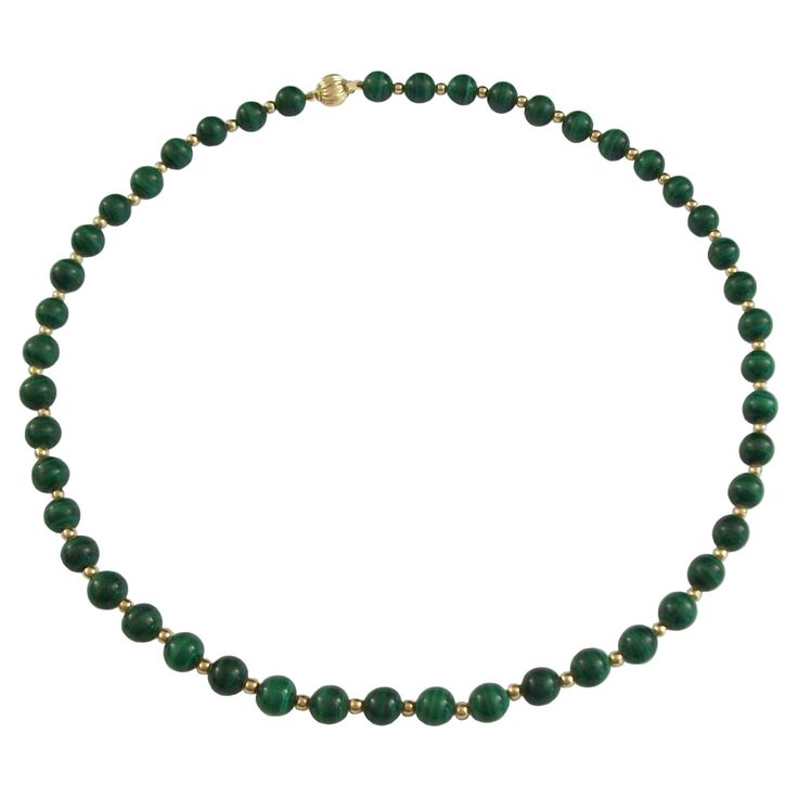 Fine vintage malachite and 14K yellow gold beaded necklace - featuring 47 round polished malachite beads (8 mm. diameter) and 46 gold spacer beads (3 mm. diameter) - original 14K gold clasp with safety catch - no maker's mark - stamped 585 on the clasp - France - late 20th century. Excellent vintage condition - no loss - no damage - no repairs - minor signs of age and use - ready to wear. Size/Dimensions - Medium - 5/16" (8 mm.) Diameter x 20" Long (51.0 cm.). Weight - 48.86 Grams (Total). E 46, Gold Beaded Necklace, Gold Bead Necklace, Late 20th Century, Gold Beads, Spacer Beads, Makers Mark, 20th Century, Beaded Necklace