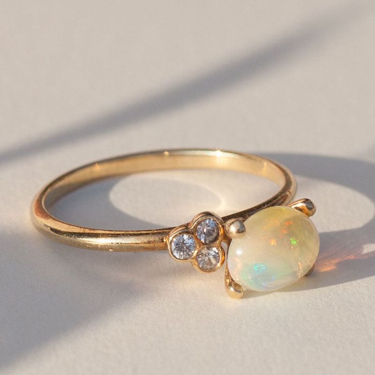 Opal Engagement Ring 14K Gold, Solid Yellow Gold (your choice - White or Rose Gold) Natural Opal 6x8 mm 3 (1,25 mm) Diamonds (conflict free), round cut, color/clarity - F/VS1 Band thickness: 2 mm Go Custom Ask for customization of this ring or make a completely new one: one2threejewelry.com/pages/custom-rings. Feel free to contact: contact@one2threejewelry.com Engagement Ring With Opal, Fire Opal Ring Engagement, Opal Ring Engagement, Affordable Engagement Ring, Opal Stone Ring, Birthstone Engagement Rings, Opal And Diamond Ring, Opal Engagement Ring, Detailed Engagement Ring