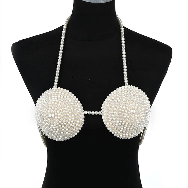 This Faux Pearl Beaded Body Chain Micro Top is a perfect way to make a stylish statement. Perfectly accented with faux pearls, its delicate design adds a sophisticated flourish to any outfit. Wear it out to a formal event or dress up a casual night out. Clothing length: ultra-short (clothing length≤40cm) Popular elements: Pearl suspender underwear Fabric name: ABS pearl * Return and exchange are not supported Chic Evening Pearl Necklace, Glamorous White Pearl Chain Necklace, Silver Beaded Pearl Necklace For Parties, Beaded Pearl Necklace With Round Beads For Evening, Elegant Summer Party Jewelry, Chic Pearl White Necklace For Party, Chic Pearl Drop Necklace For Party, Chic Pearl White Pearl Necklace For Party, Glamorous Pearl Chain Necklace For Party