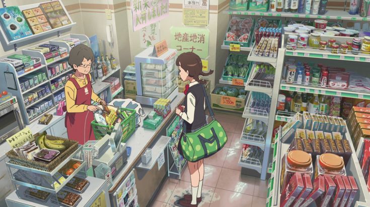 two people standing in front of a store filled with food and drink items, looking at each other