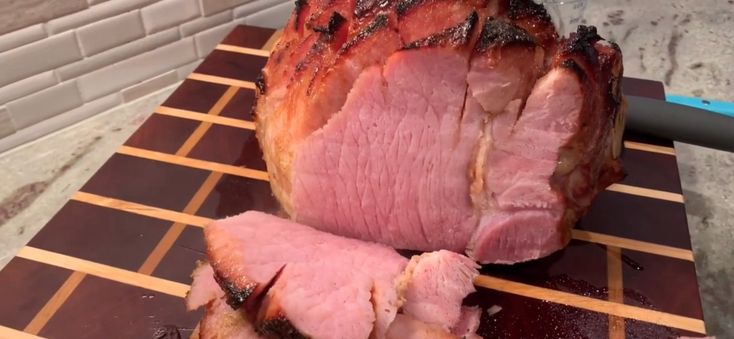 a large piece of meat sitting on top of a cutting board