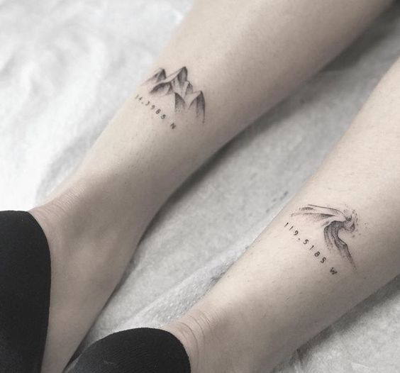 two people with tattoos on their legs and feet