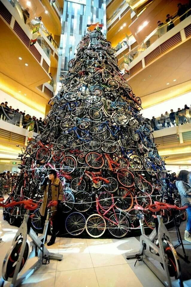 a large christmas tree made out of bicycles