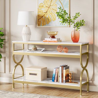 a living room scene with focus on the console table and bookshelf in the foreground