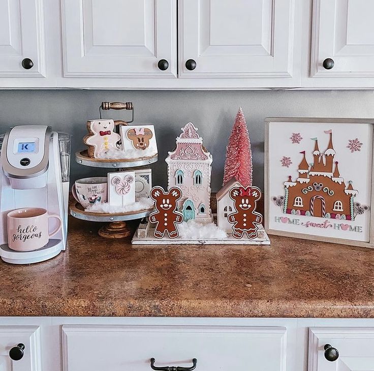 a kitchen counter with gingerbread cookies and other items on it, including a coffee maker