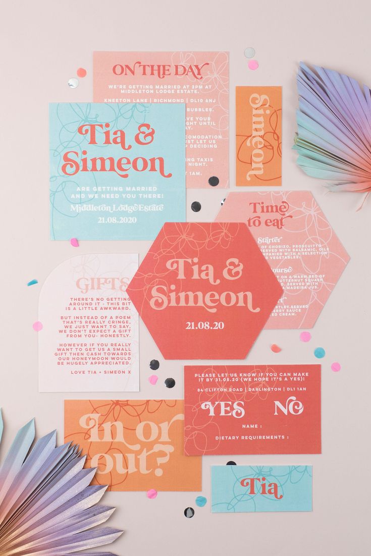 colorful wedding stationery with paper fans and confetti