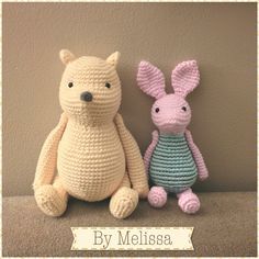 two crocheted stuffed animals sitting next to each other