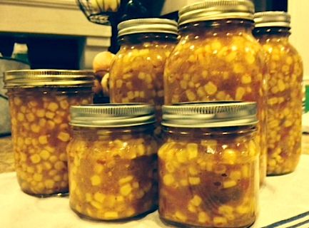 several jars filled with food sitting on top of a table