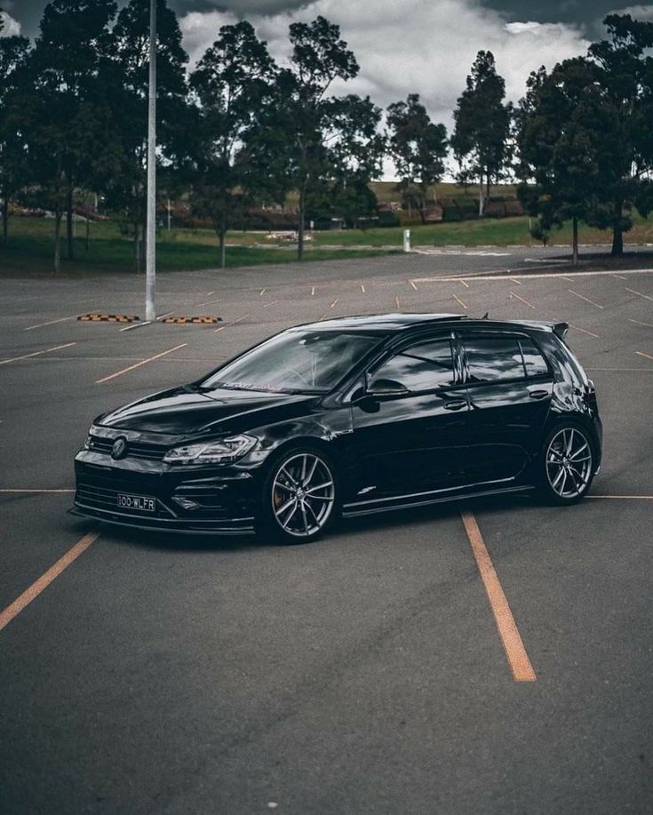 a black car parked in a parking lot