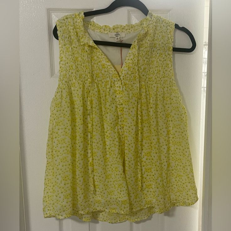 Nwt- Never Worn Brand New Yellow And White Flowy Summer Sleeveless Blouse With Liner And Shell Flower Pattern. Faux Button And Tie Strings. Super Cute For Summer! Yellow Feminine Blouse, Yellow Feminine Blouse For Daywear, Feminine Yellow Blouse For Daywear, Feminine Yellow Blouse For Day Out, Yellow Floral Print Top For Daywear, Yellow Sleeveless Blouse For Beach, Yellow Sleeveless Blouse For The Beach, Sleeveless Yellow Blouse For The Beach, Feminine Yellow Tops For Beach