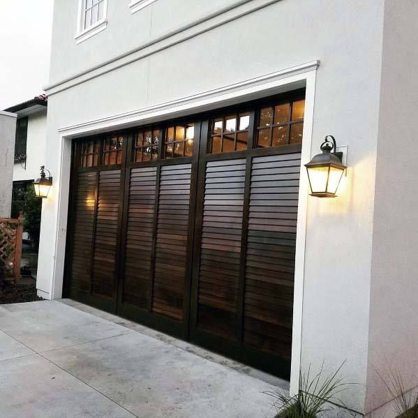 a white house with a brown garage door