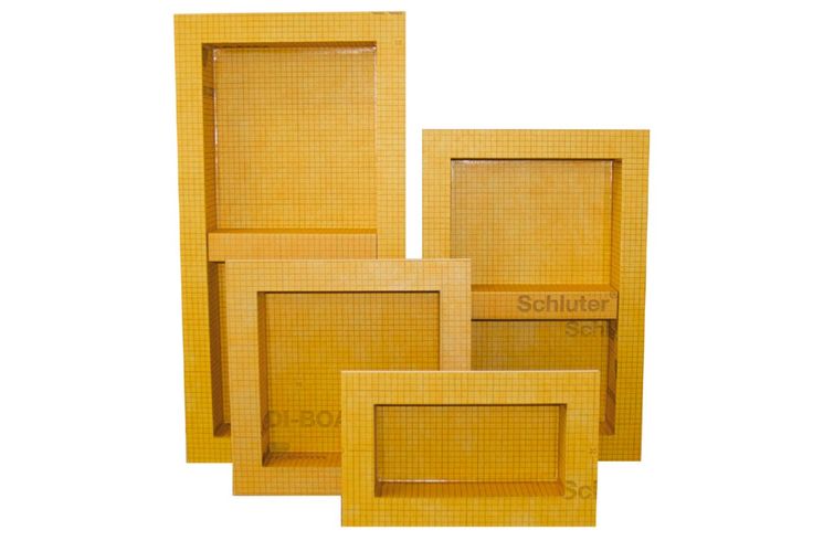 four wooden frames sitting next to each other on a white surface with the word schluter printed on them