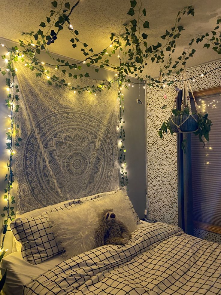 a dog is sitting on a bed with lights strung from the ceiling