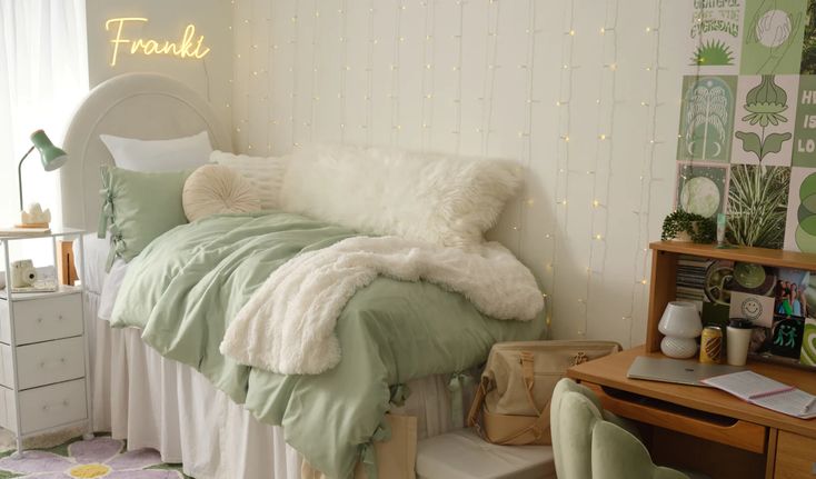 a bedroom with a bed, desk and chair in front of a wall decorated with lights