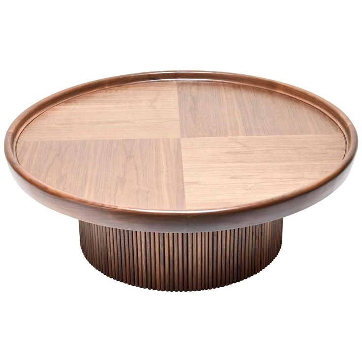 a round wooden table with an interesting design