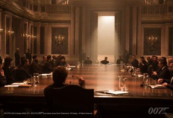 a group of people sitting around a conference table