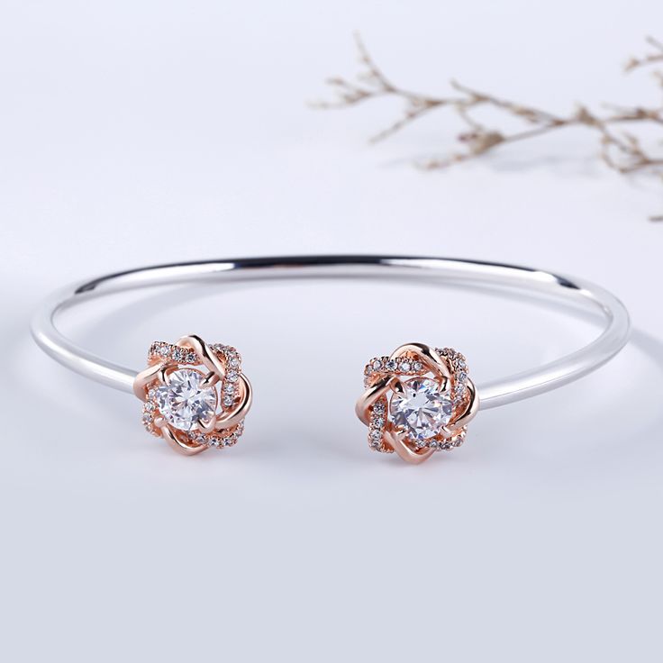 Surround her with flowers all year long. Buy that special someone this silver flower bangle, whether she is celebrating a holiday or if she is just a lover of flowers. Crafted in two tone sterling silver, the bangle consists from two blossoms on the two ends and a high polished bangle, which shows simple elegance. The cuff bangle is easy to adjust the size to fit for her wrist. Surprised her with this charming piece.Carat Weight: 3 ctStone Size: 6 mmNumber of Stones: 2 Stone Shape: RoundStone Co Fine Jewelry Rose Gold Cuff Bracelet For Anniversary, Rose Gold Cuff Bracelet For Anniversary, Rose Gold Bangle For Anniversary In Fine Jewelry Style, Rose Gold Fine Jewelry Cuff Bracelet For Anniversary, Rose Gold Bangle For Anniversary, Fine Jewelry, Rose Gold Bangle For Anniversary In Fine Style, Rose Gold Fine Jewelry Bangle For Anniversary, Rose Gold Bangle For Gift Fine Jewelry, Elegant Sterling Silver Bracelet For Anniversary And Mother's Day