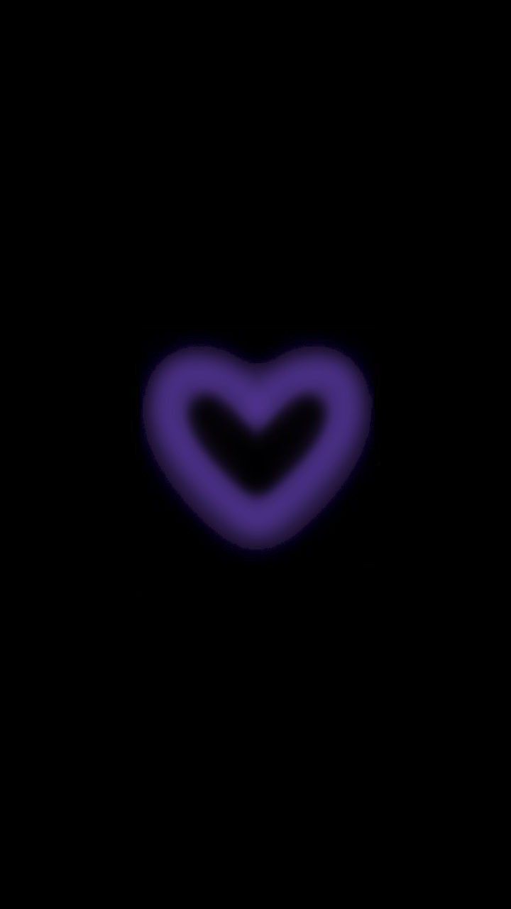 a purple heart on a black background