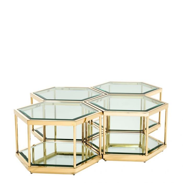 three glass and brass hexagonal tables with shelves on each side, set against a white background