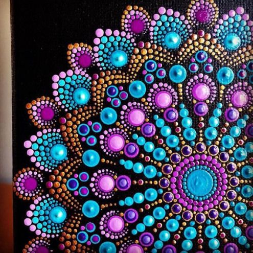 an abstract painting with blue, purple and orange circles on black canvases that are painted in acrylic paint