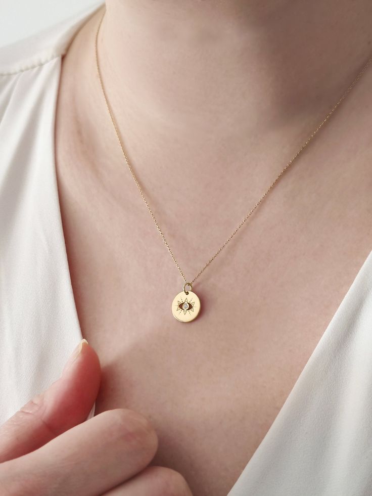 18K 14K 9K Dainty Diamond Evil Eye Necklace, Minimalist Small Evil Eye Charm Necklace, Solid gold layering necklace, Lucky charm, Gift for Her, Gift for mom, Kabbalah Jewelry, FREE EXPRESS SHIPPING Dainty, minimalist solitaire diamond evil eye charm necklace with a unique design and made in 18K, 14K or 9K gold. An absolute staple! Whisper...My new Lucky charm! ------------------------------------------------- D E T A I L S 18K, 14K or 9K Solid Gold Disc size: 12mm/ approx. 0.47'' Natural white d Dainty Gold Plated Charm Necklace With Round Pendant, Dainty Gold-plated Charm Necklace With Round Pendant, Dainty Yellow Gold Plated Charm Necklaces, Dainty Yellow Gold-plated Charm Necklace, Dainty Yellow Gold Plated Charm Necklace, Yellow Gold Plated Charm Necklace For Her, Yellow Gold Plated Charm Necklace As Gift For Her, Gold Plated Yellow Gold Charm Necklace For Her, Gold Fine Jewelry Charm Necklace For Everyday